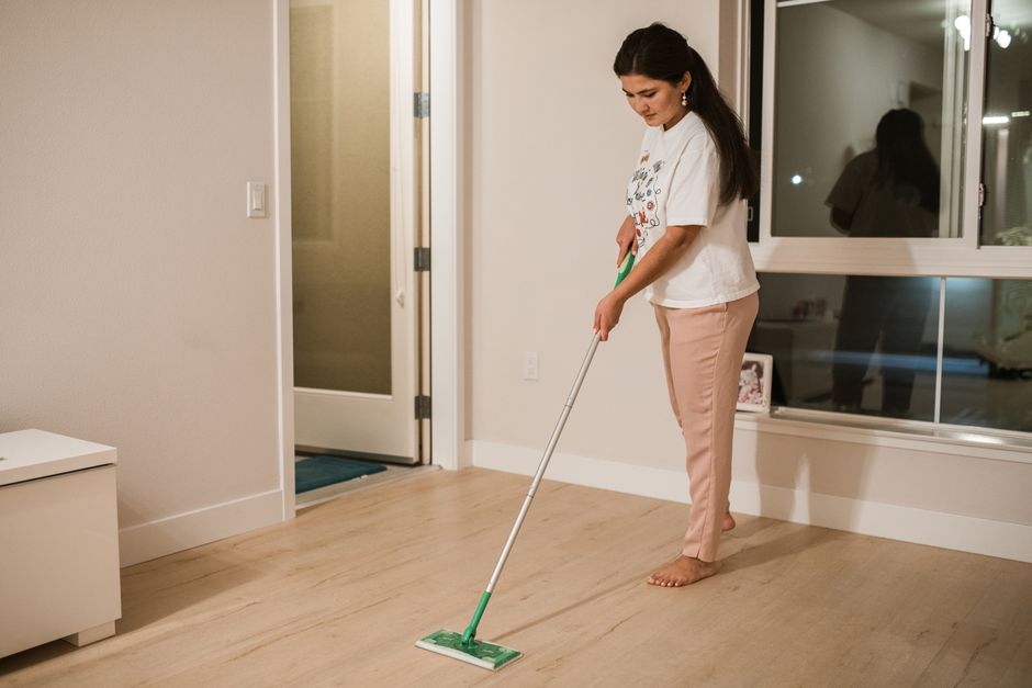 Mopping a clean hardwood floor